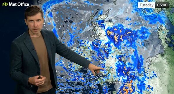 Met Office meteorologist Alex Burkill presents a weather forecast map showing heavy rain and thunderstorms affecting parts of south-east England and e Met Office meteorologist Alex Burkill presents a weather forecast map showing heavy rain and thunderstorms affecting parts of south-east England and e