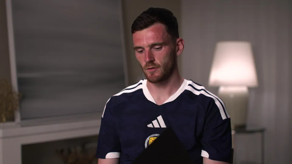 Scotland's Andy Robertson reading a letter from Diogo Jota's wife Rute ahead of World Cup