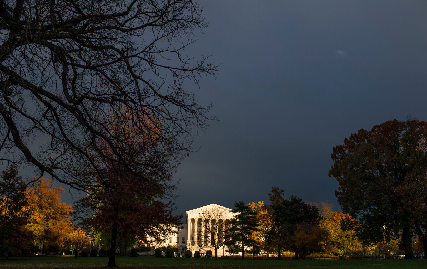A beam of sunlight breaks through the cloudy skies to illuminate the Supreme Court in Washington.