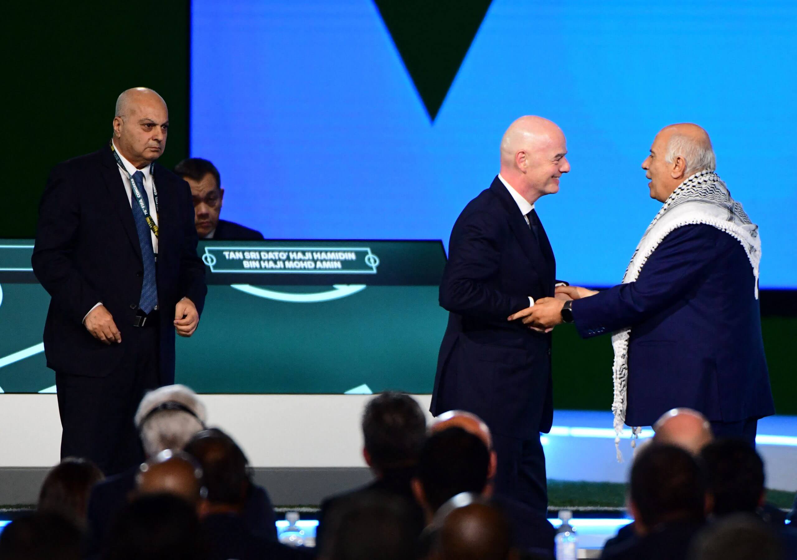 Suliman (l) with Infantino (c) and Rajoub (r)