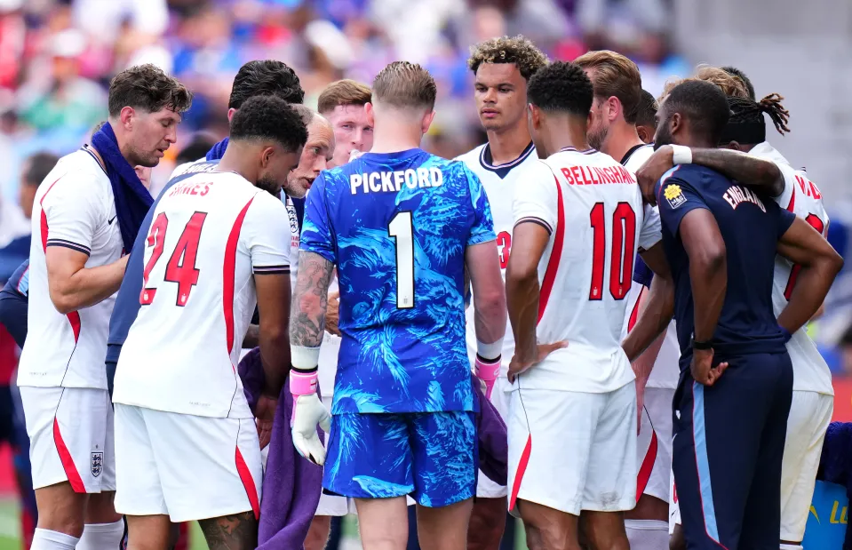 England players gather on sidelines against Costa Rica
