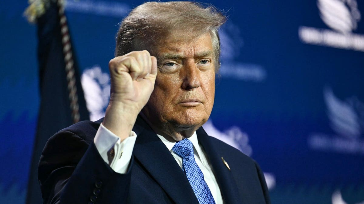 President Trump pumps fist in air at Faith & Freedom Coalition.
