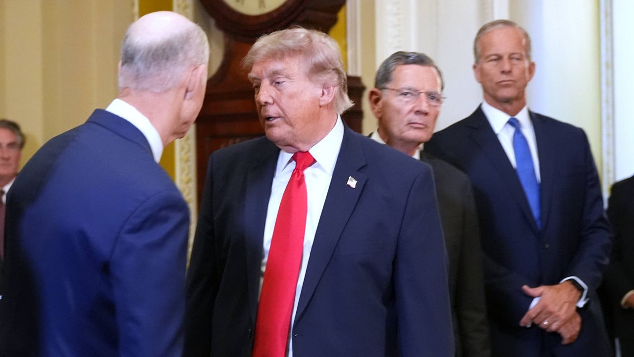 President Donald Trump turns to depart after speaking with reporters as Sen. Rick Scott, R-Fla., from left, Sen. John Barrasso, R-Wyo., and Senate Majority Leader John Thune, R-S.D., listen on Capitol Hill, Wednesday, June 24, 2026, in Washington. (AP Photo/Jacquelyn Martin)