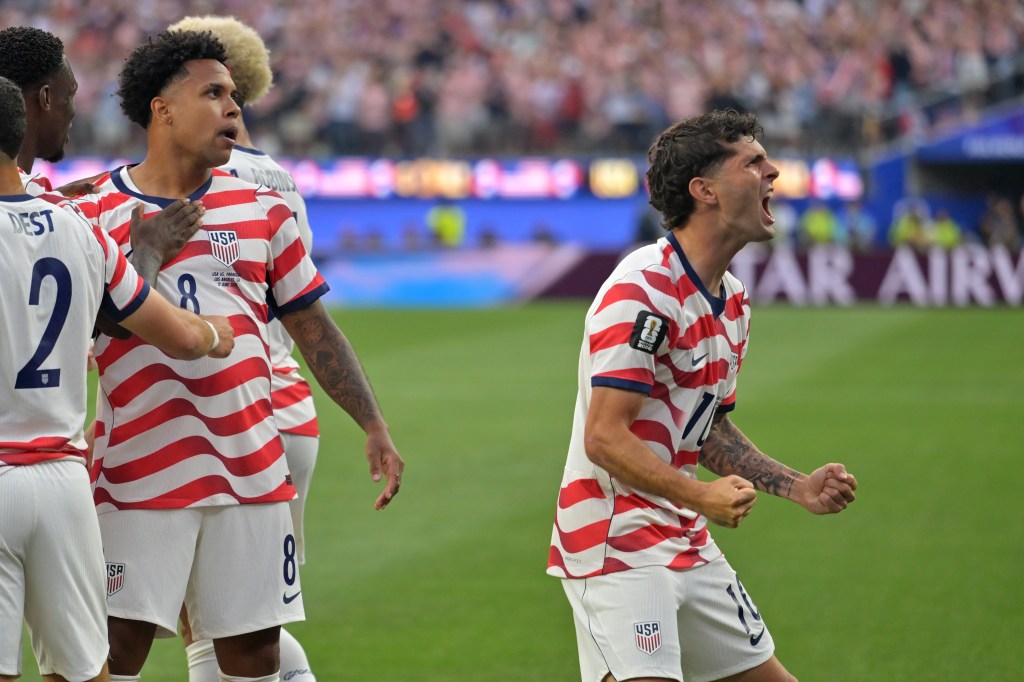 Christian Pulisic, right, celebrates with teammates after an own goal by Paraguay's Damian Bobadilla during the World Cup Group D soccer match in Inglewood, Calif., near Los Angeles, Friday, June 12, 2026. 