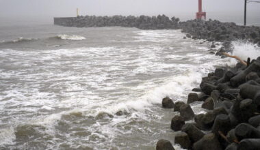 2 tropical storms pound Japan with floods and landslides