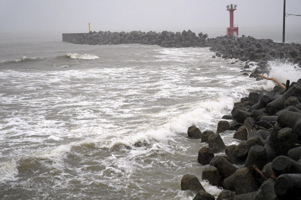 2 tropical storms pound Japan with floods and landslides