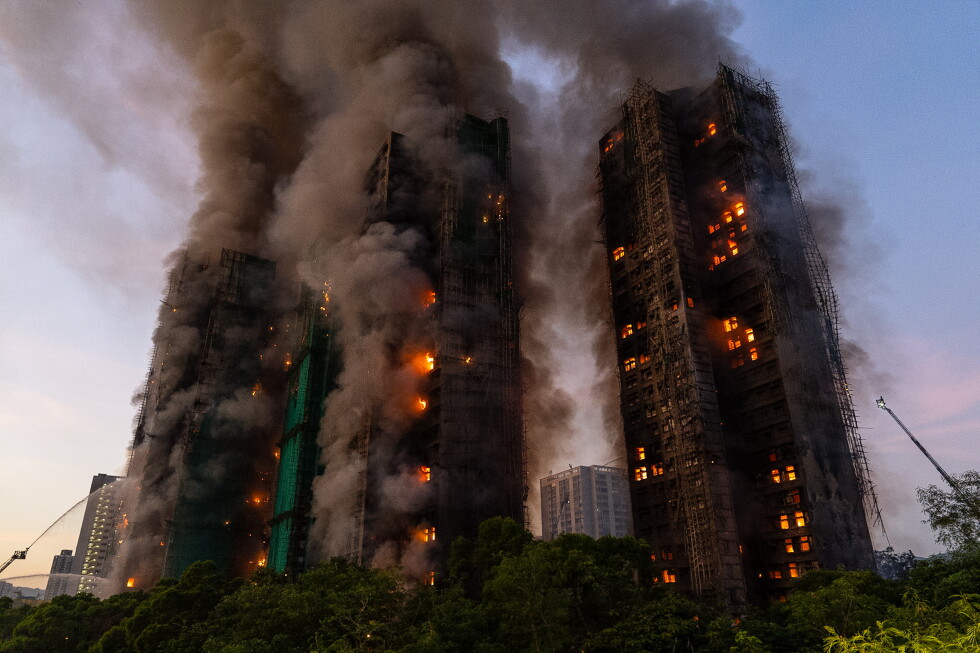 Hong Kong charges 7 people over apartment fire that killed 168