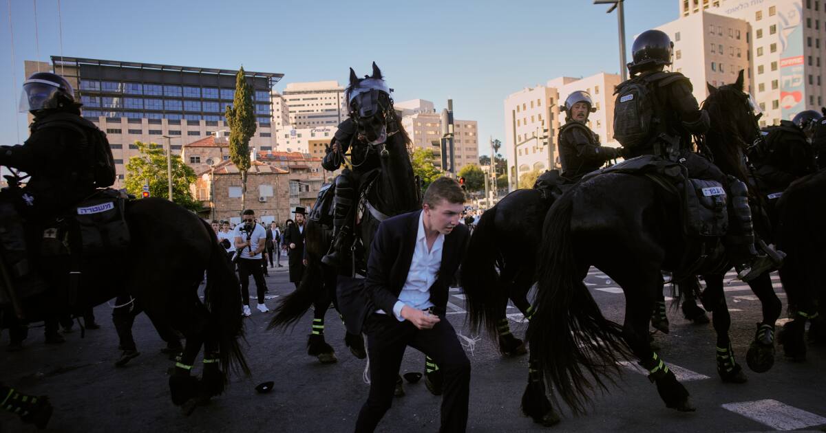 Ultra-Orthodox protesters block roads and trains across Israel over military draft