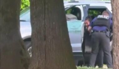 DHS says detained man "violently resisted arrest" outside Baltimore school