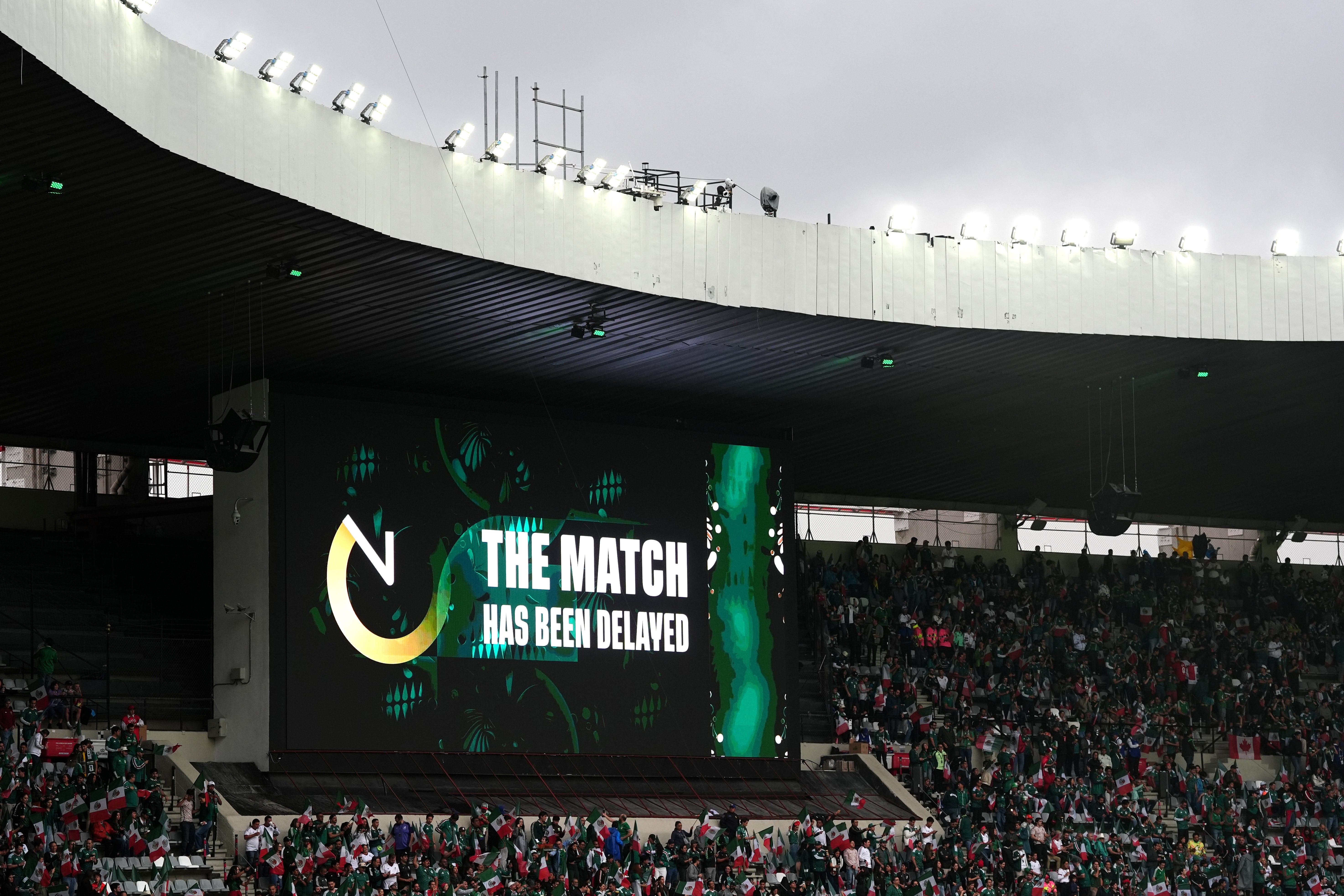 A general view of a match delay notice on the big screen ahead of the FIFA World Cup Round of 16 match