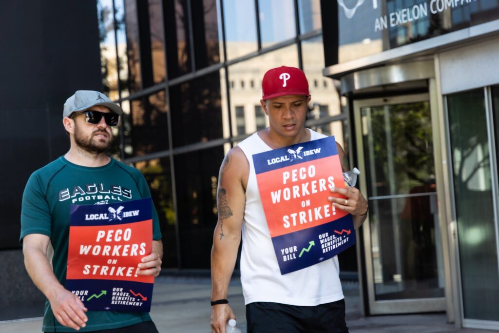 Striking PECO workers picket outside the company headquarters