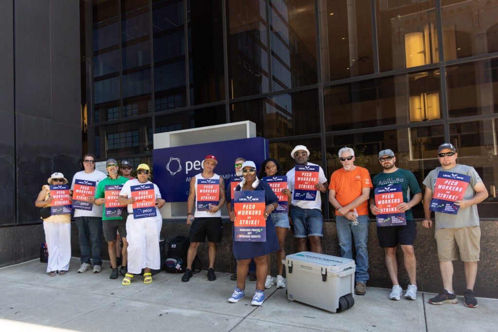 Striking PECO workers picket outside the company headquarters