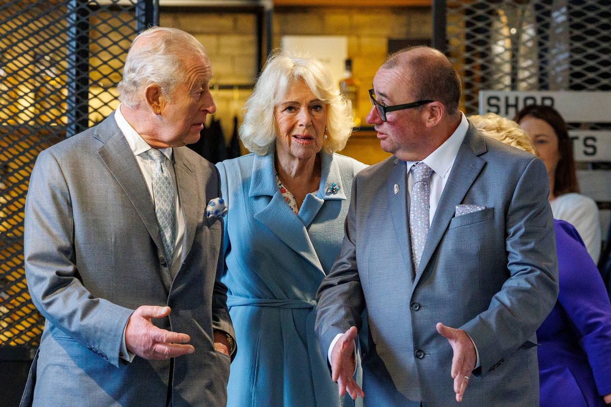 King Charles and Queen Camilla with Peter Lavery during a visit to Titanic Distillers