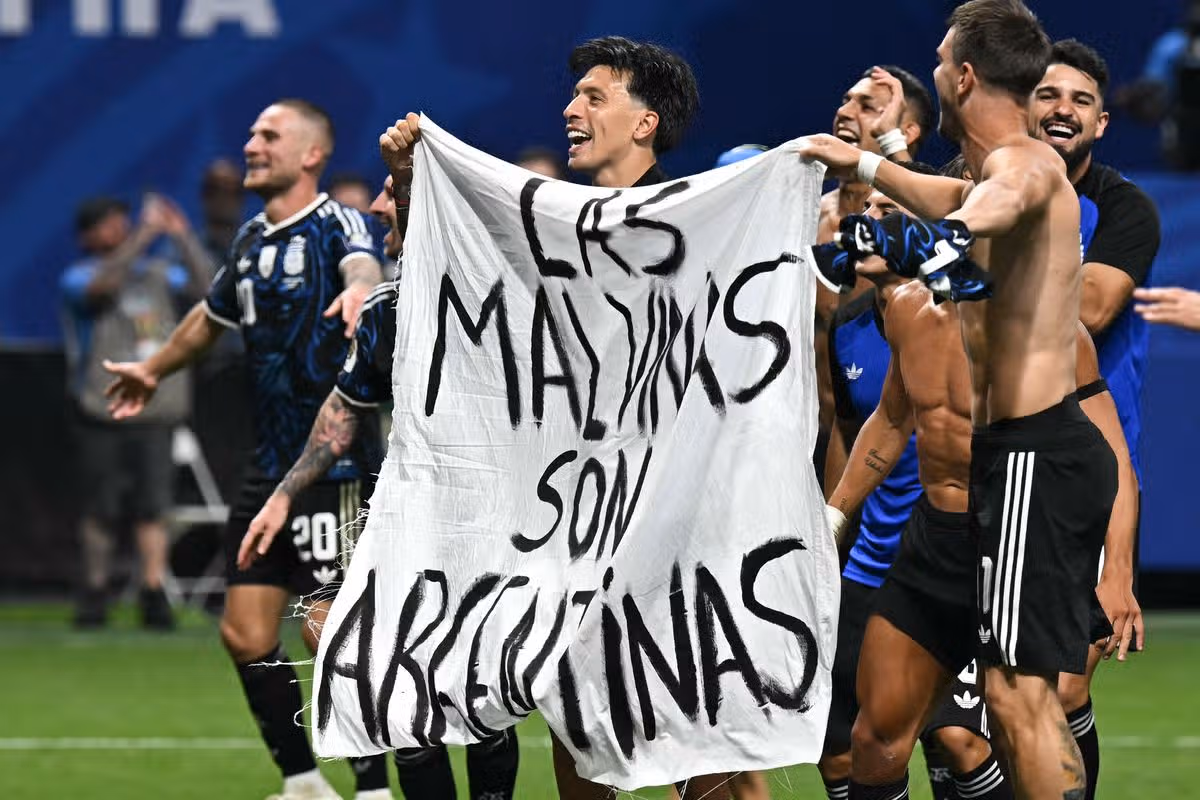 Argentina's players held up a banner reading "The Malvinas (Falkland Islands) belong to Argentina" after beating England in the World Cup semi-final