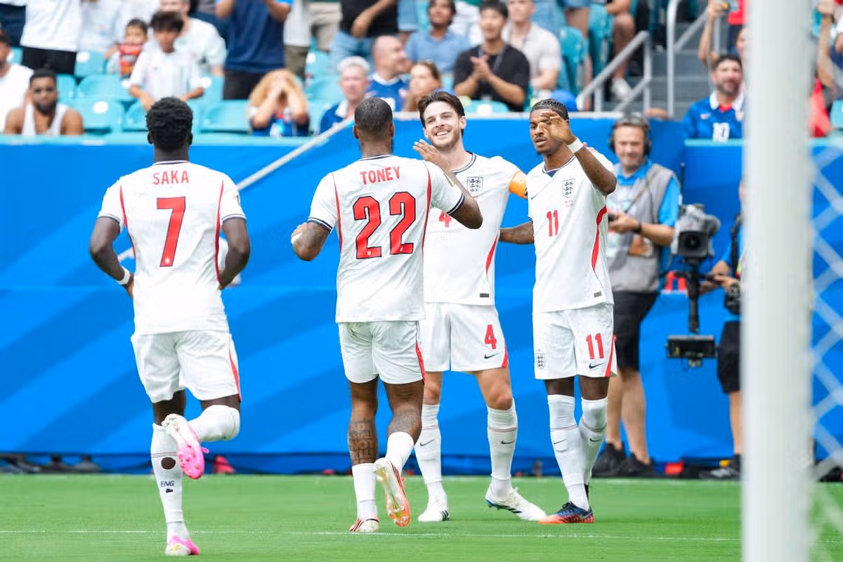 Declan Rice of England (C) and team mates celebrate after scoring the team's first goal during a FIFA Men's World Cup 2026 Bronze Final football match between France and England at Miami Stadium, in Miami Gardens on July 18th 2026