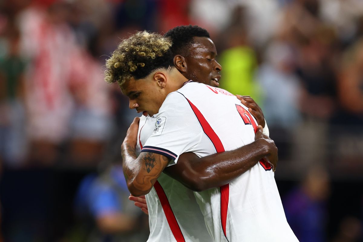 Marc Guehi of England reacts with Nico O'Reilly 