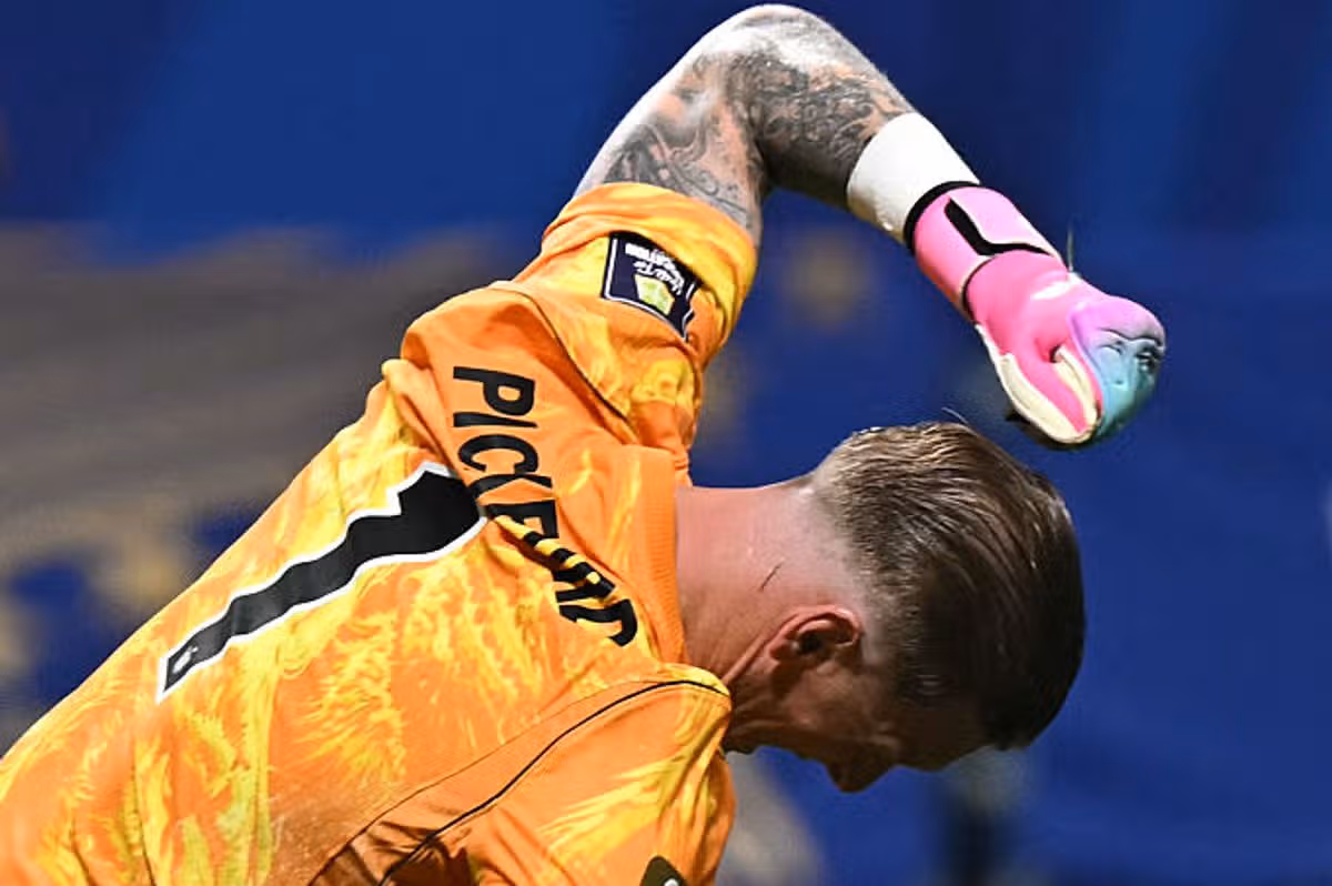 England's goalkeeper #01 Jordan Pickford reacts after Argentina's midfielder #24 Enzo Fernandez scored during the 2026 World Cup football tournament semi-final match between England and Argentina at the Atlanta Stadium in Atlanta on July 15, 2026. (Photo by Paul ELLIS / AFP via Getty Images)