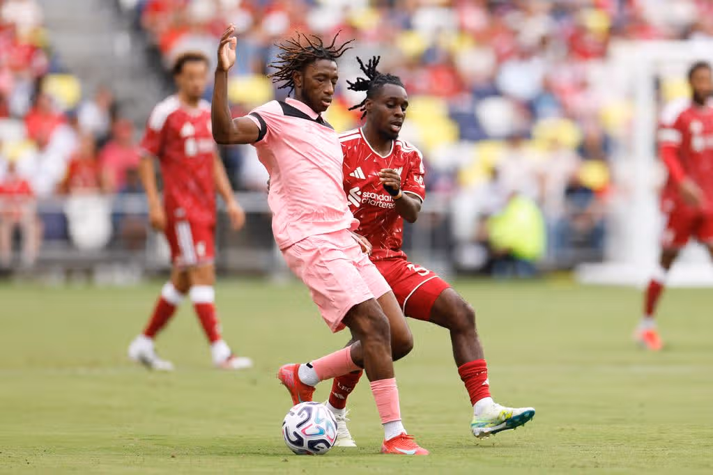 Jeremie Frimpong fights for possession during Liverpool vs Sunderland.