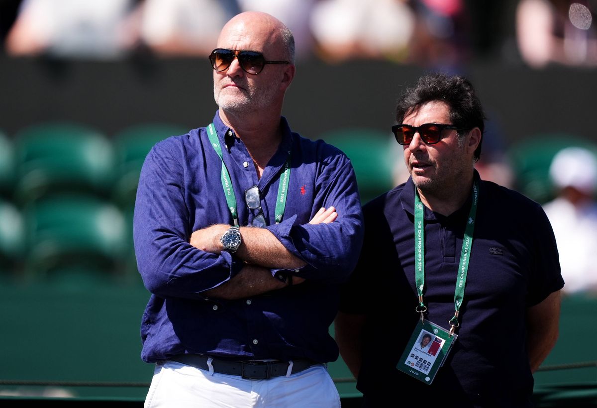 Loic Fery, father of Arthur Fery, watching a practice session at Wimbledon