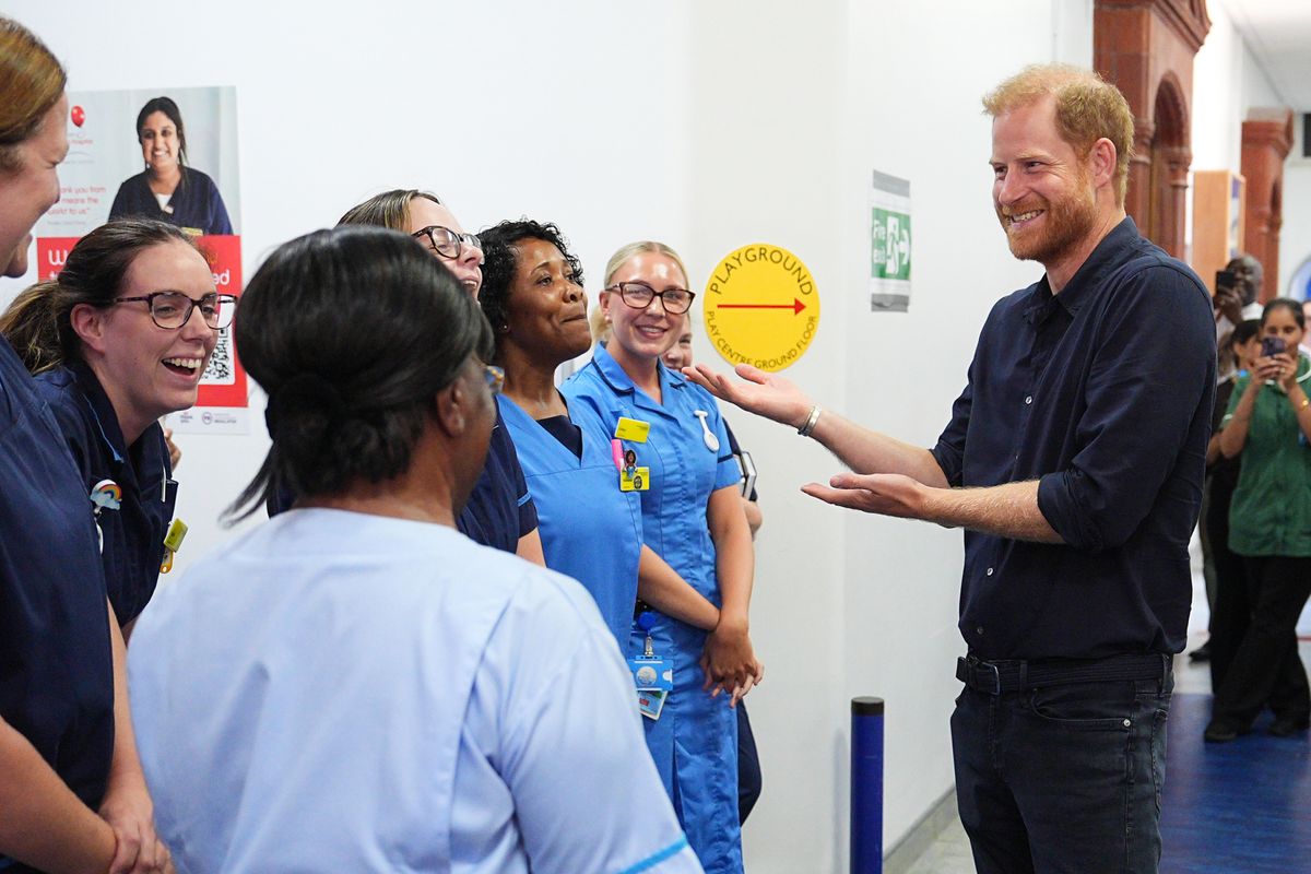 Harry chats with nursing staff during a visit to the Birmingham Children's Hospital