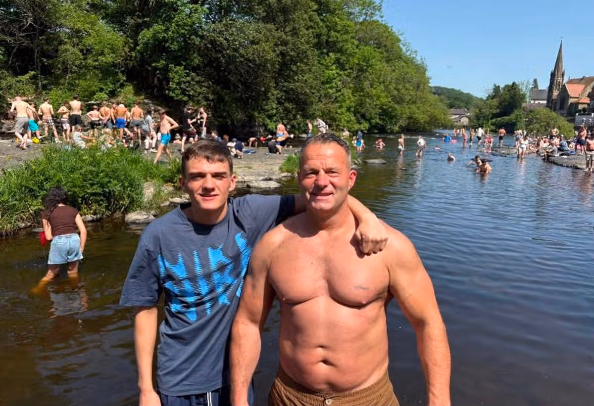 Andrew Tinsley, 46, with his son