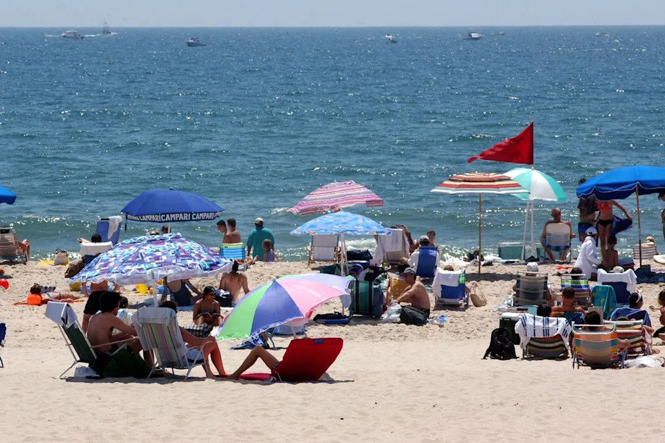 Stock image of people on a Long Island beachCredit: Spencer Platt/Getty
