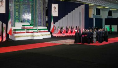 Iranian religious leaders and other mourners pay their respects before the coffins of slain Iranian Supreme Leader Ayatollah Ali Khamenei and members of his family during a viewing ceremony ahead of the dayslong funeral ceremonies at the Imam Khomeini Mosalla Grand Mosque in Tehran, Iran, Friday, July 3, 2026. (AP Photo/Vahid Salemi)