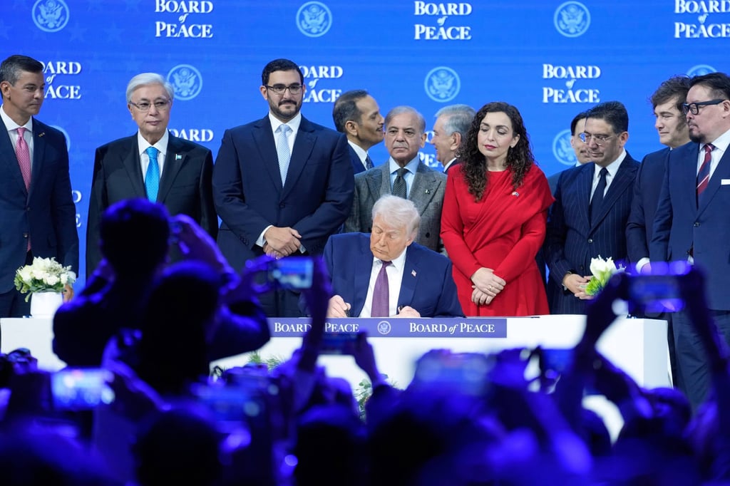 US President Donald Trump signs the charter of his Board of Peace initiative at the World Economic Forum in Davos, Switzerland in January. Photo: AP