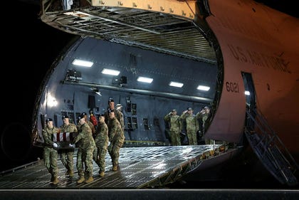 Coffin of U.S. soldier who died in Kuwait arriving in Delaware, March. Credit: Win Mcnamee/Getty Images via AFP Coffin of U.S. soldier who died in Kuwait arriving in Delaware, March.