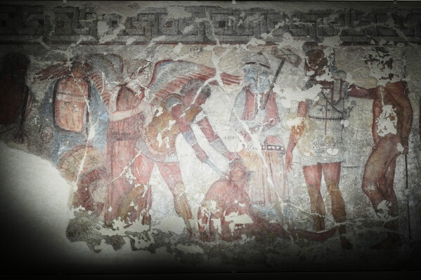 "The Sacrifice of the Trojan Prisoners", a fresco dating from 330–310 B.C., is exhibited in the reconstruction of the François Tomb, an Etruscan tomb, at the Villa Giulia Etruscan Museum in Rome, Tuesday, June 30, 2026. (AP Photo/Alessandra Tarantino)