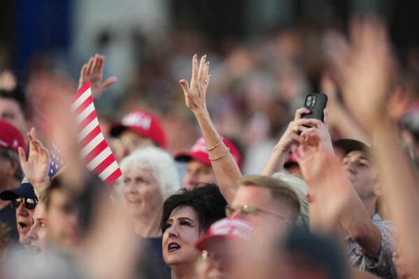 People listen before President Donald Trump speaks at the opening of the Great American State Fair on the National Mall, Wednesday, June 24, 2026, in Washington. (AP Photo/Alex Brandon)
