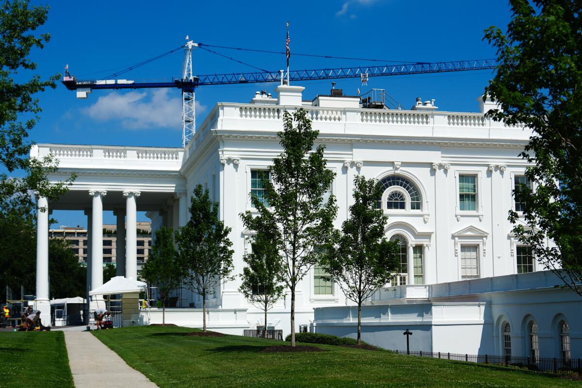 A construction crane over the White House.