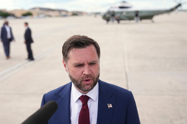 With Marine Two in the background, Vice President JD Vance speaks with reporters upon arriving at Joint Base Andrews, Md., Thursday, May 28, 2026. (AP Photo/Matt Rourke, Pool)