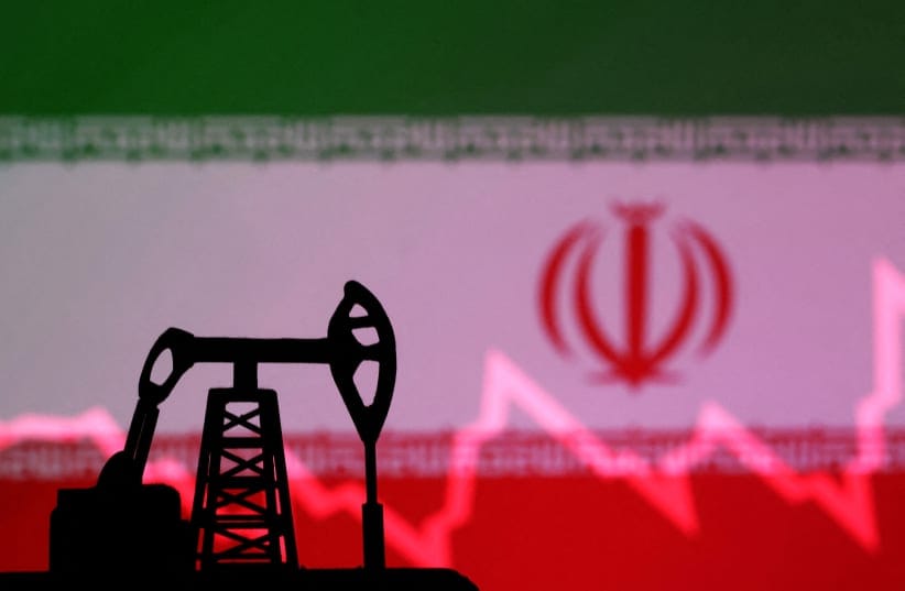  Iranian flag with stock graph and an oil pump jack miniature model are seen in this illustration taken October 9, 2023.