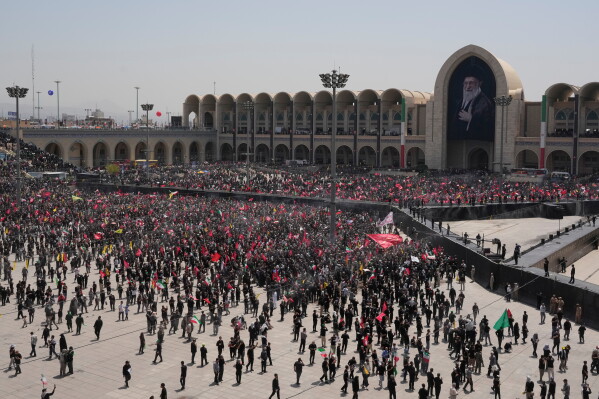 Mourners gather for the start of the dayslong funeral ceremonies for the late Iranian Supreme Leader Ayatollah Ali Khamenei and members of his family at the Imam Khomeini Mosalla Grand Mosque in Tehran, Iran, Saturday, July 4, 2026. (AP Photo/Vahid Salemi)
