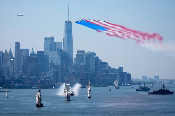 Tall ships parade under flyovers during the International Parade of Sail, part of Sail250, a gathering of tall ships and military ships, Saturday, July 4, 2026, in New York. (AP Photo/Seth Wenig)