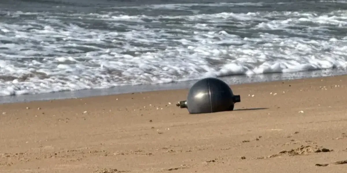 Australian authorities issue warning over mysterious space balls found washed up on beach