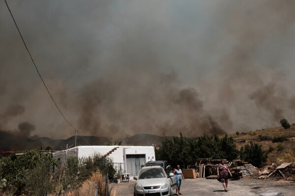 A wildfire rages in Alfajir, near Almeria in southeastern Spain, Friday, July 10, 2026. (AP Photo/Gregorio Marrero)