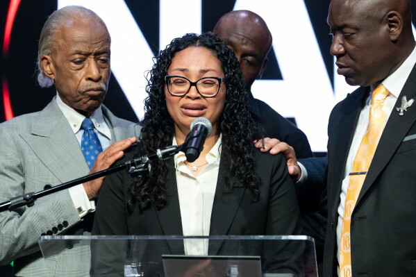 Christine Wonsley, mother of Nolan Xavier Wells, reacts as she speaks during a news conference at National Action Network headquarters, Friday, July 10, 2026, in New York. (AP Photo/Yuki Iwamura)