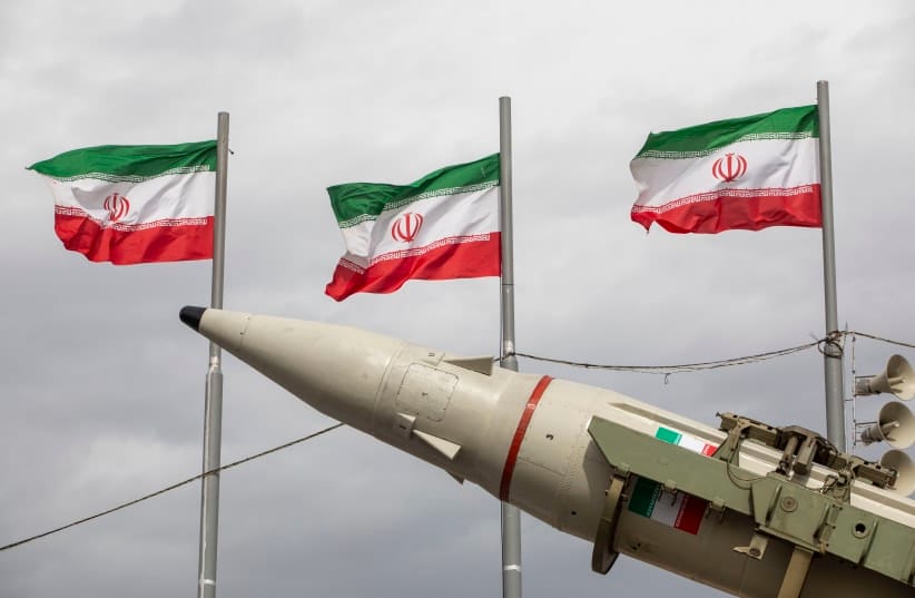 Missiles produced by Iran's armed forces are displayed near a row of Iranian flags during commemorations to mark the anniversary of the 1979 Iranian Revolution on February 11, 2026 in Tehran, Iran.