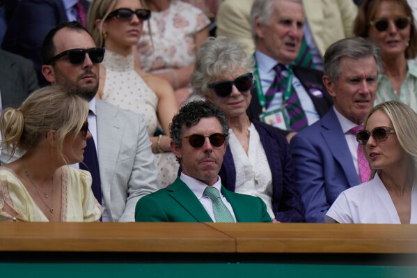 Golfer Rory McIlroy of Northern Ireland sits in the royal box during day three of the Wimbledon Tennis Championships in London, Wednesday, July 1, 2026. (AP Photo/Brian Inganga)