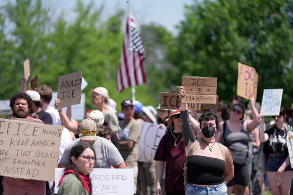 Protesters gather near the scene of a shooting involving U.S. Immigration and Customs Enforcement, Monday, July 13, 2026 in Biddeford, Maine. (AP Photo/Robert F. Bukaty)