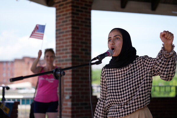 Eisha Khan speaks at a rally of protesters near the scene of a shooting involving U.S. Immigration and Customs Enforcement, Monday, July 13, 2026 in Biddeford, Maine. (AP Photo/Robert F. Bukaty)