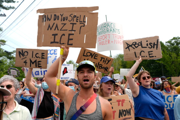 Protesters gather near a U.S. Immigration and Customs Enforcement facility in Scarborough, Maine, one day after the shooting of Johan Sebastián Durán Guerrero, Tuesday, July 14, 2026. (AP Photo/Robert F. Bukaty)
