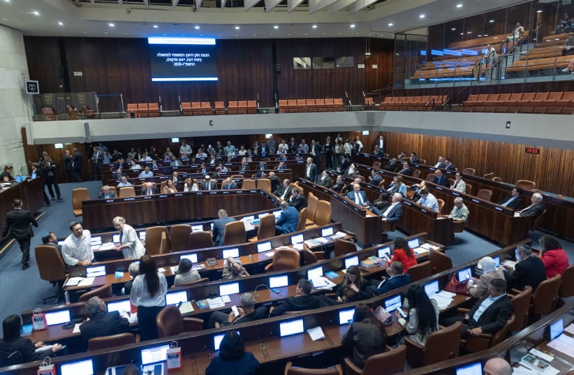 MK's attend a plenum session and a vote on a bill to split the duties and powers currently held by the attorney general between two separate officeholders, at the assembly hall of the Knesset, the Israeli parliament in Jerusalem, July 15, 2026.  (credit: YONATAN SINDEL/FLASH90)