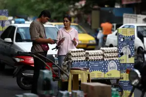 Iran faces region’s harshest mix of wartime contraction and inflation