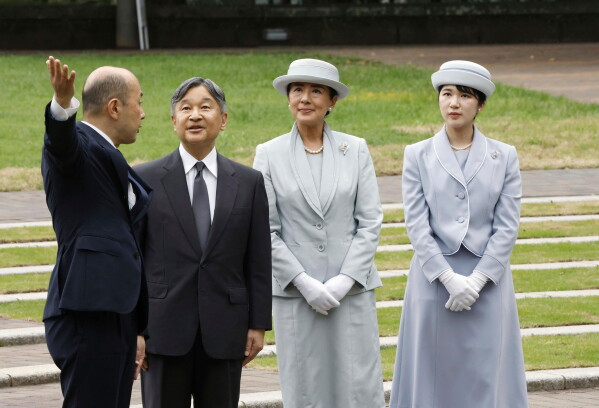Japanese Emperor Naruhito, center left, Empress Masako center right, and Princess Aiko, right, listen to Nagasaki Mayor Shiro Suzuki as they visit the cenotaph for the atomic bombing victims at the peace park in Nagasaki. western Japan, Sept. 12, 2025. (Kyodo News via AP, File)