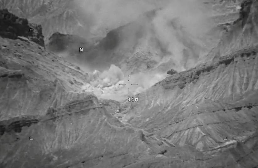 Smoke rises from an explosion at an unknown location, during what U.S. Central Command (CENTCOM) says are strikes on Iran, in this screen grab taken from a handout video released on July 18, 2026.