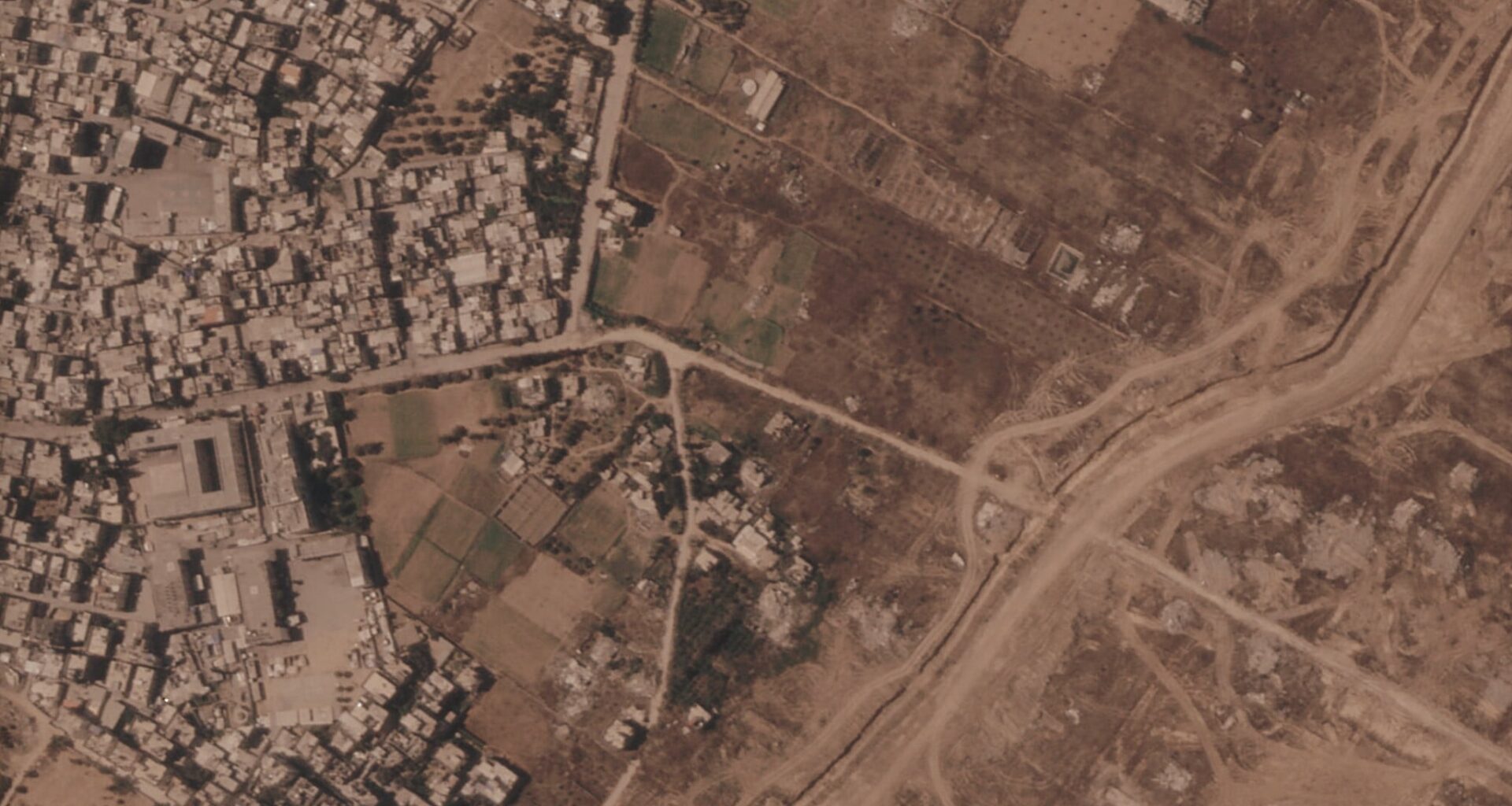 Photos show Israel building miles-long earthen barrier inside area it holds in Gaza