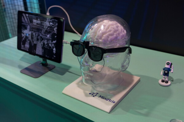 A display demonstrates a brain-computer interface from Mindtrix during the World AI Conference in Shanghai, Saturday, July 18, 2026. (AP Photo/Ng Han Guan)